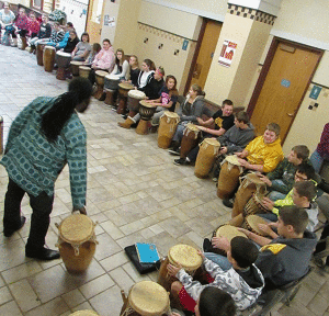 Theo Martey, who grew up in Accra, Ghana, is the founder and director of the Akwaaaba Ensemble. An internationally acclaimed musician, Theo and his group immerse students in African songs, rhythms, cultures and dance, then perform together for classmates and parents.