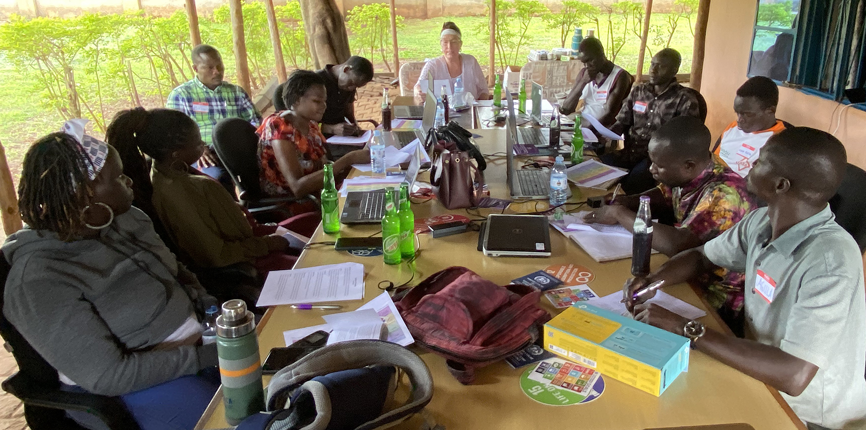 Gertrude working with members of the CPA team to plan lessons and activities in the Gender Equity-Wash and other 2022-23 Words Into Deeds programs.